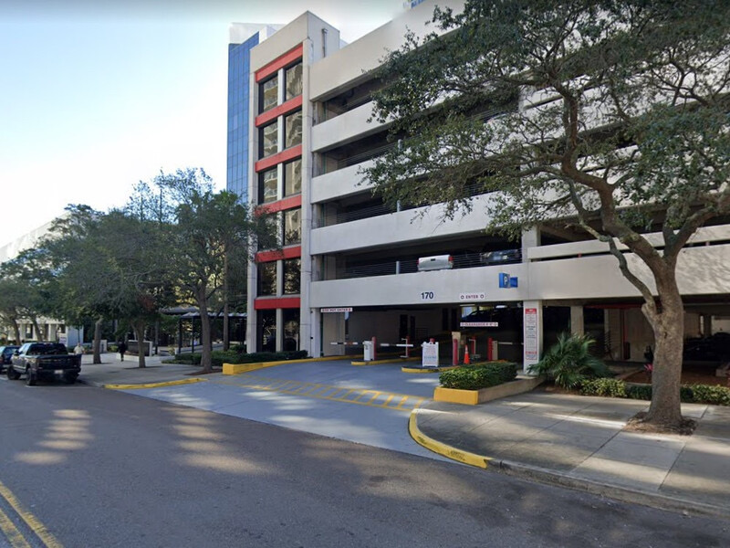 A multi-story parking garage entrance with the number 170 above the gated lane